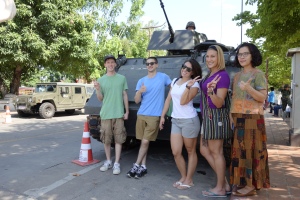 Taking pictures in front an LAV with a random Thai person.